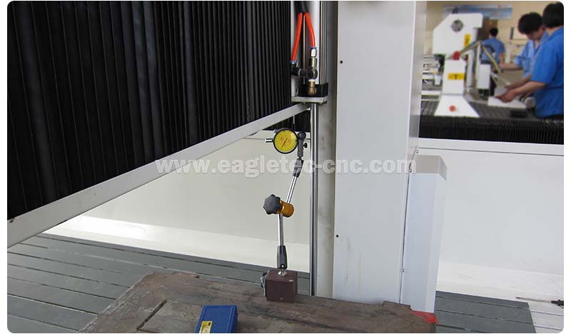 cnc router mold making machine under inspection with dial gauge