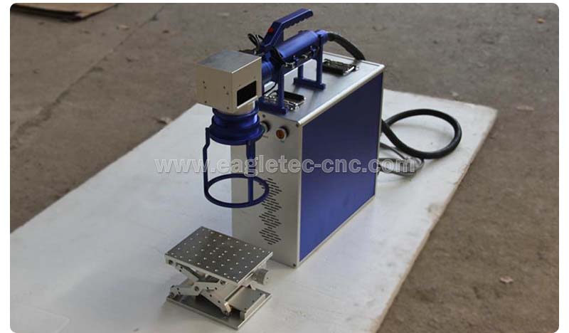 EagleTec handheld fiber laser marking machine on the floor