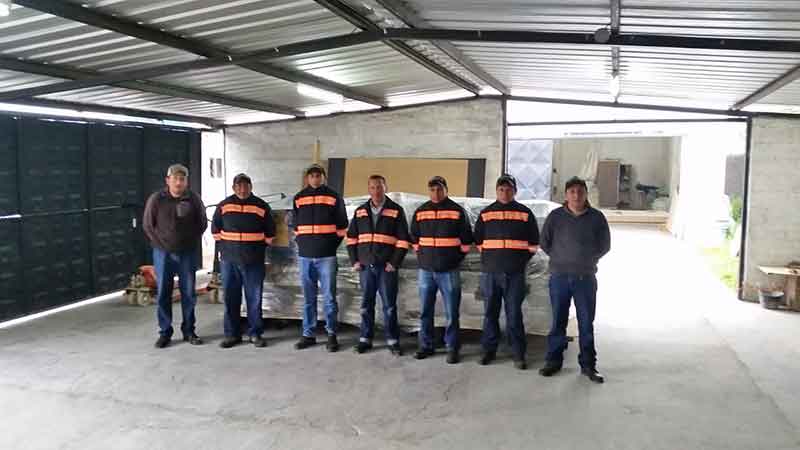customer's team stood in front of the double head cnc router 