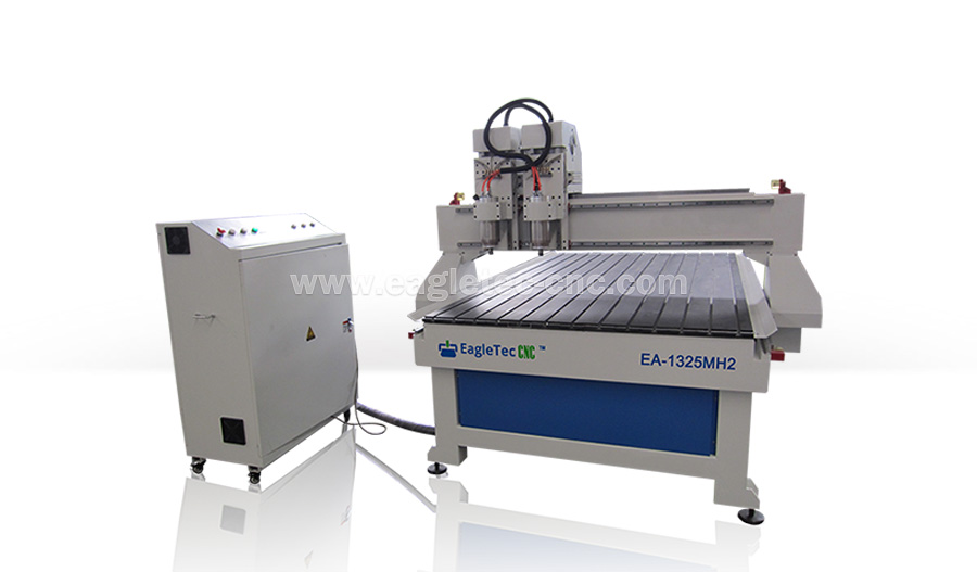 the blue and white twin head cnc router machine is placed on the ground