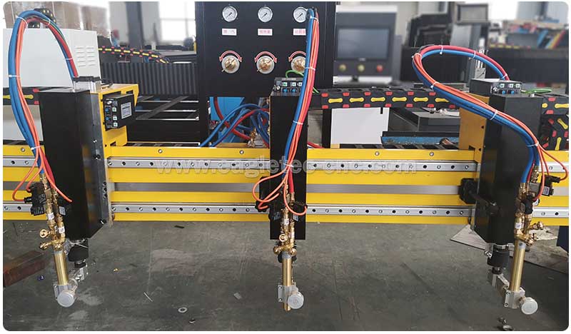 three oxy fuel gas cutting torches on the gantry of CNC flame cutting machine