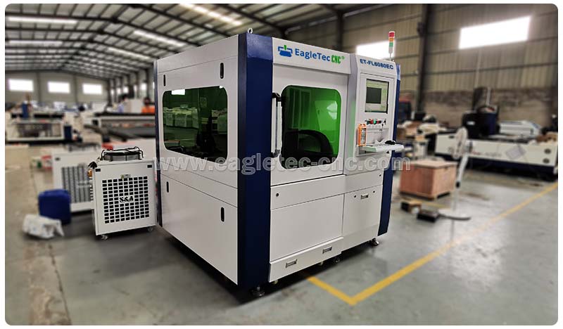 small enclosed metal laser cutting machine ready in the workshop
