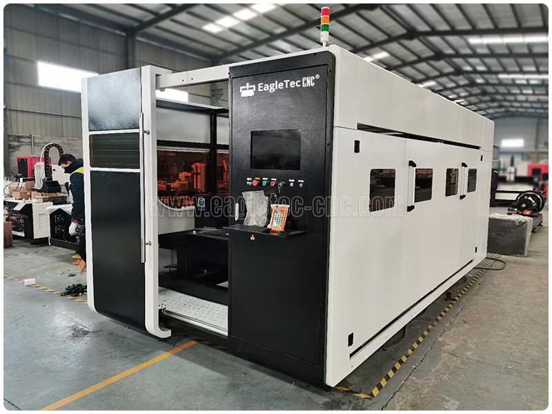 fully enclosed fiber laser cutting machine with dark acrylic windows on the cover