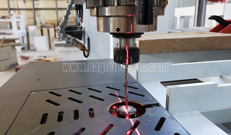 two upper and lower spindles hold a spiral milling bit for thick hardwood cutting