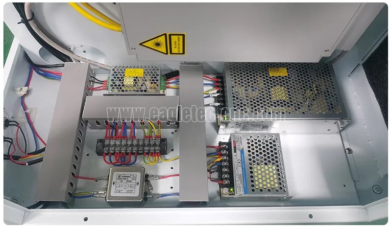 small electronics inside the cabinet of the barcode laser engraving machine