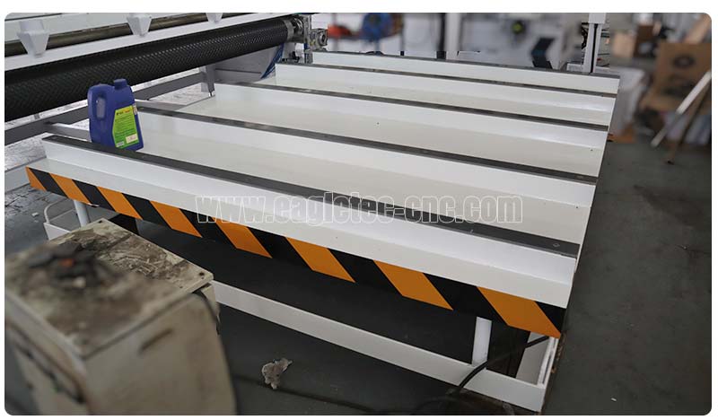 rear unloading platform for multiple spindle slatwall cutting machine