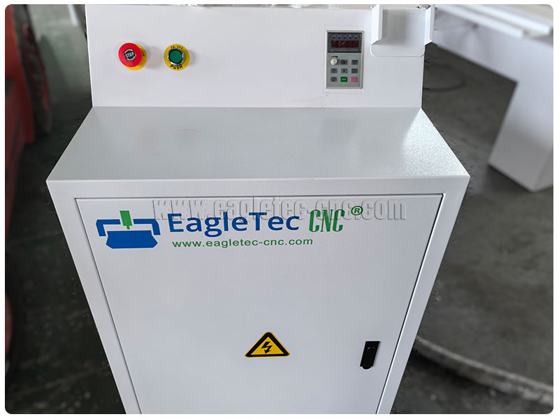 independent electric control cabinet stands next to the cnc stoneworking router