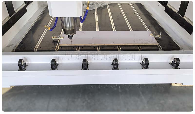 several rollers for easy loading are installed at the front of the cnc stone engraving machine bed