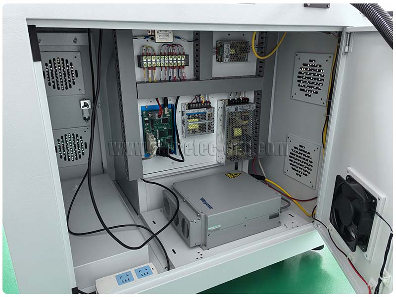 laser source seated inside of the electronic cabinet of 20 watt fiber laser engraver laser source seated inside of the electronic cabinet of 20 watt fiber laser engraver